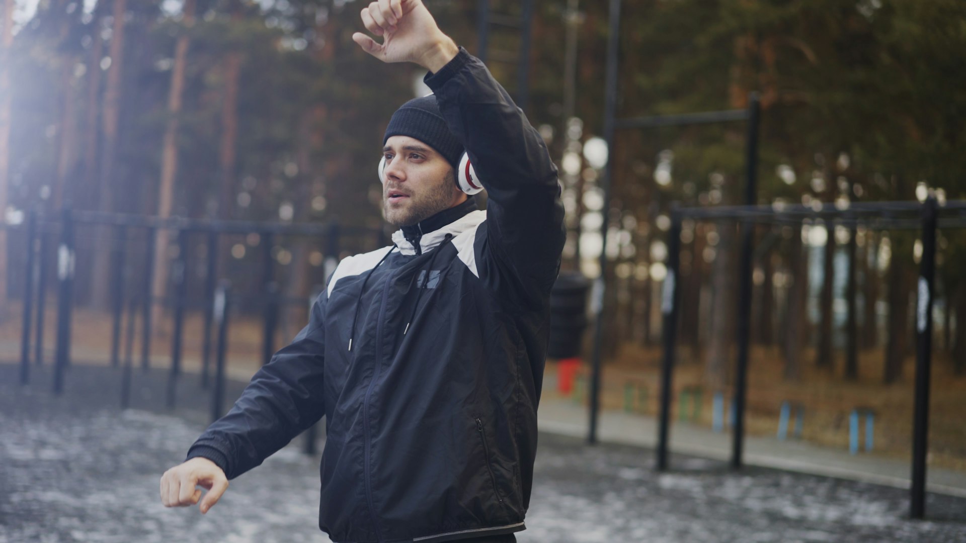 Man exercising outdoors with headphones on.